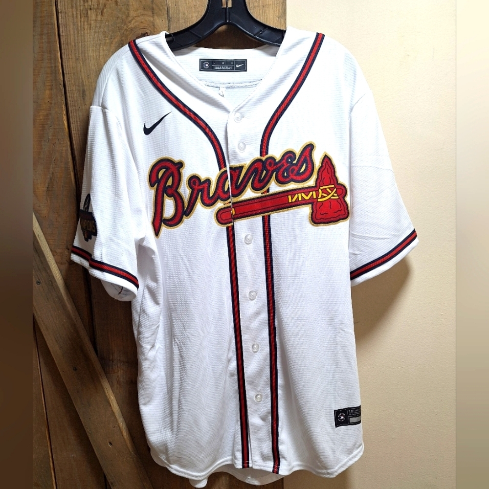 A Nike Genuine Merchandise Atlanta Braves #1 Albies jersey in multiple sizes.